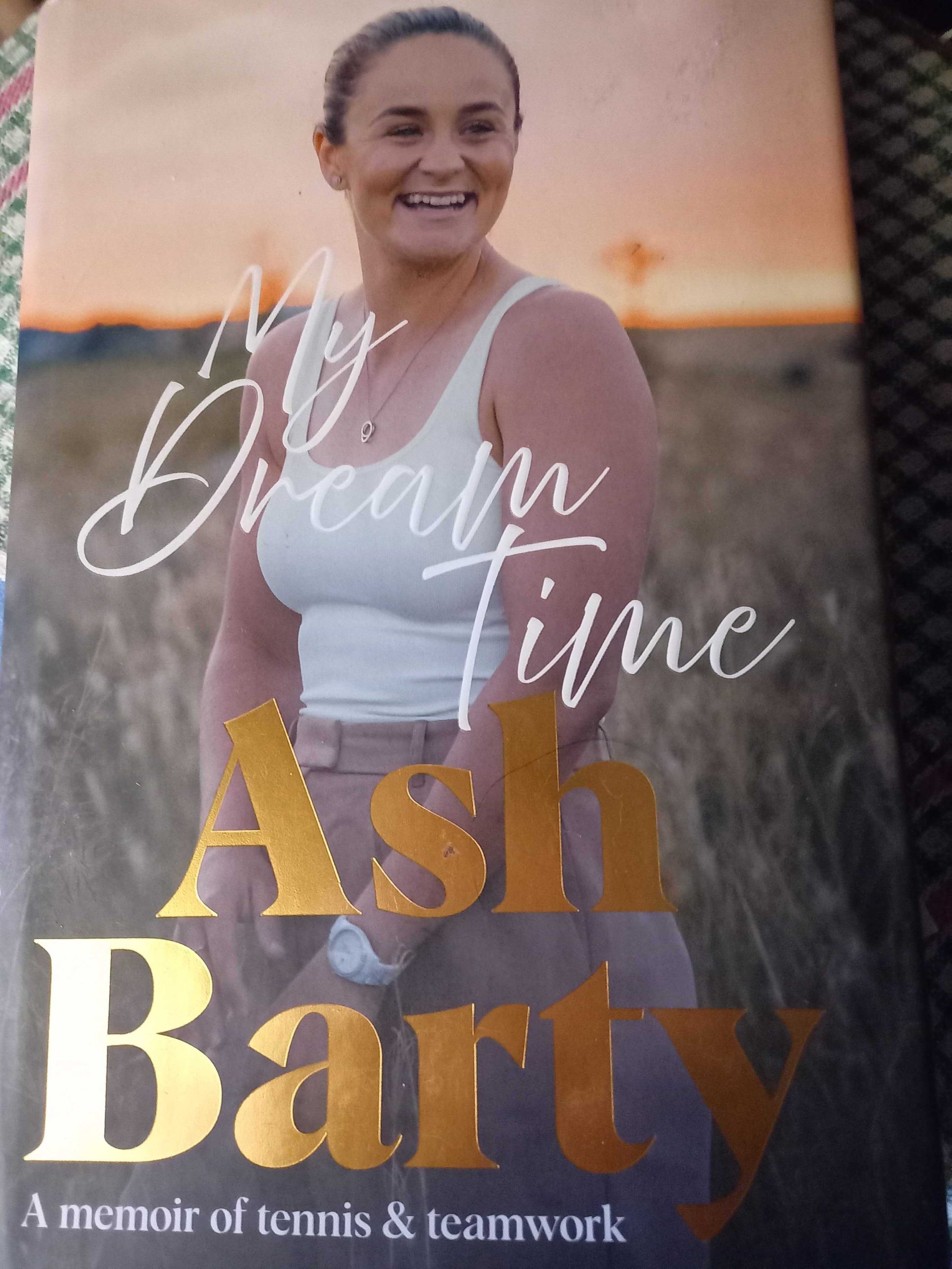 Ash Barty My Dream Time A photo of Ash Barty smiling at sunset.